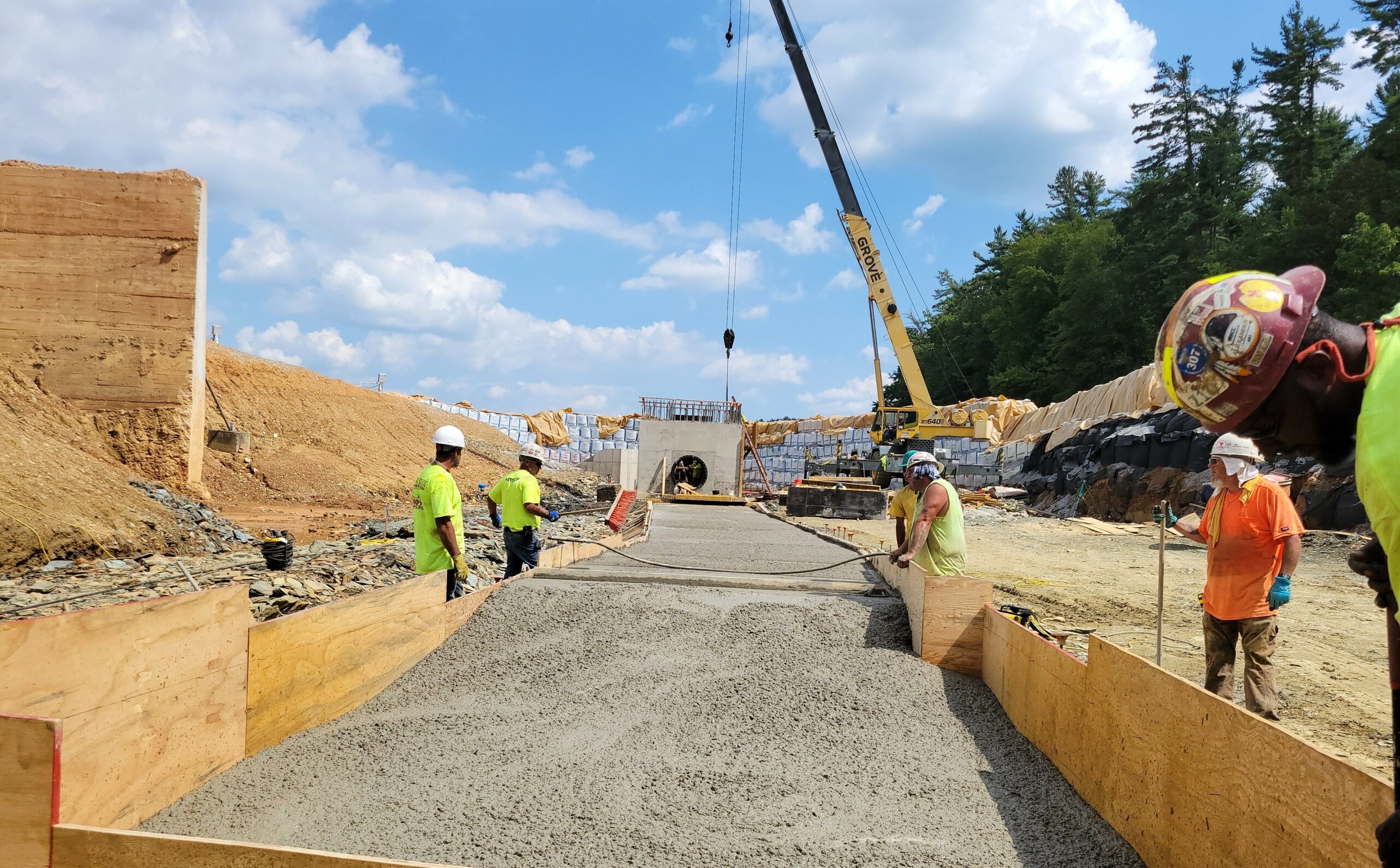 Fill material for the new 48” pipe that will be installed from the valve tower to the spillway is being placed.
