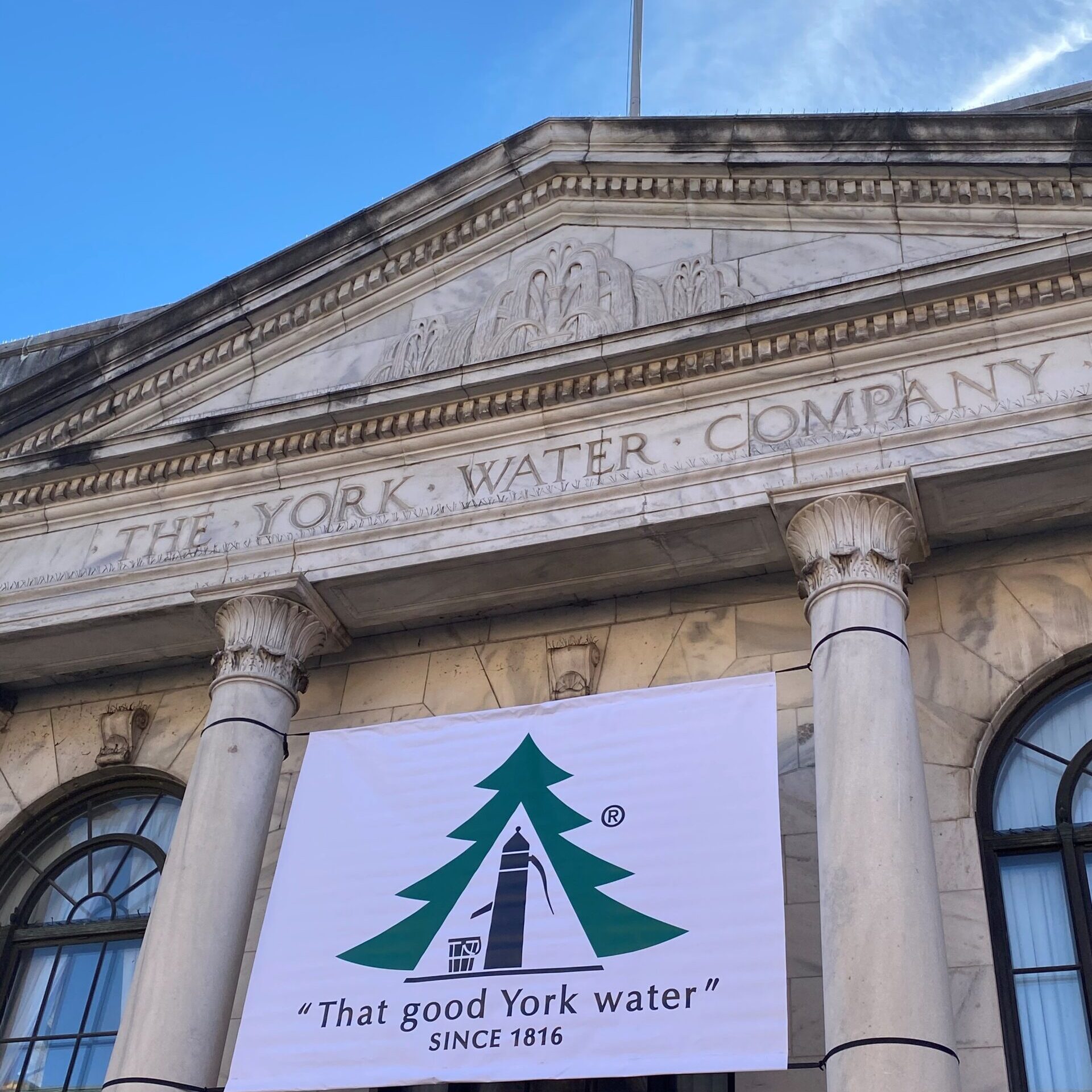 The York Water building with a logo banner flying from the building.