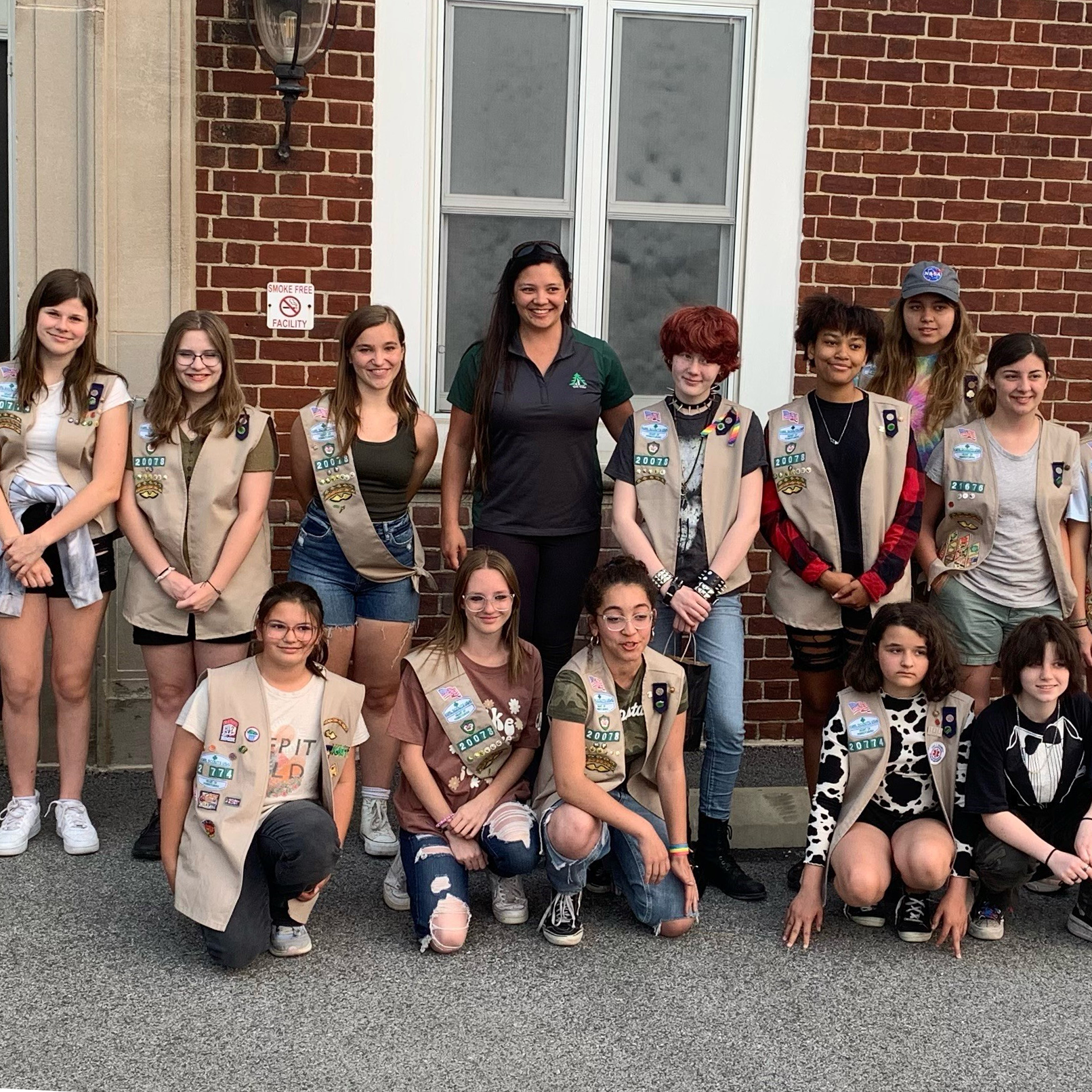 Photograph of York Water employee Katrina with a group of smiling Girl Scouts