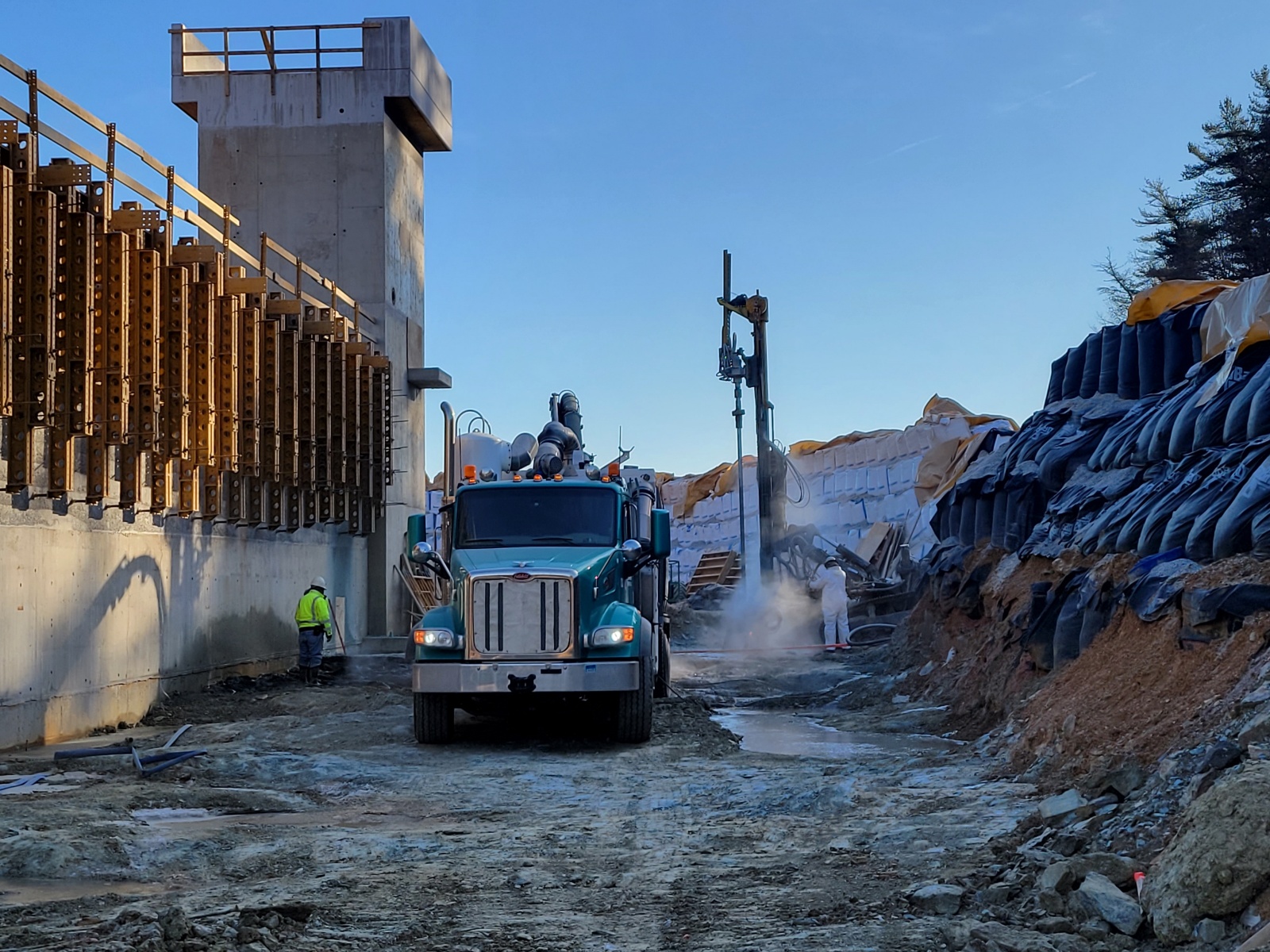 Drilling and pouring concrete.