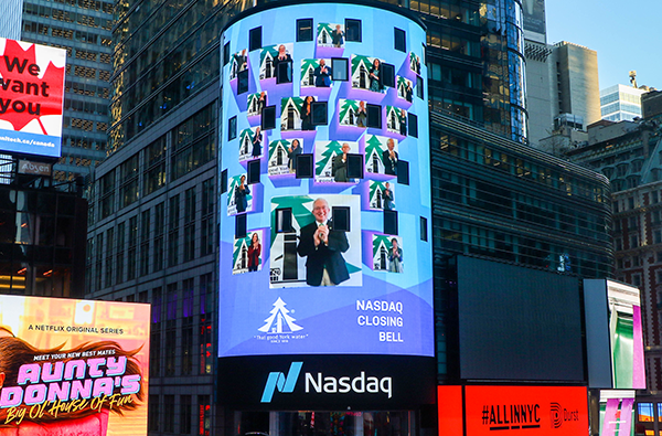 The NASDAQ screen in Times Square is shown at the Closing Bell. York Water representatives are pictured on the screen.