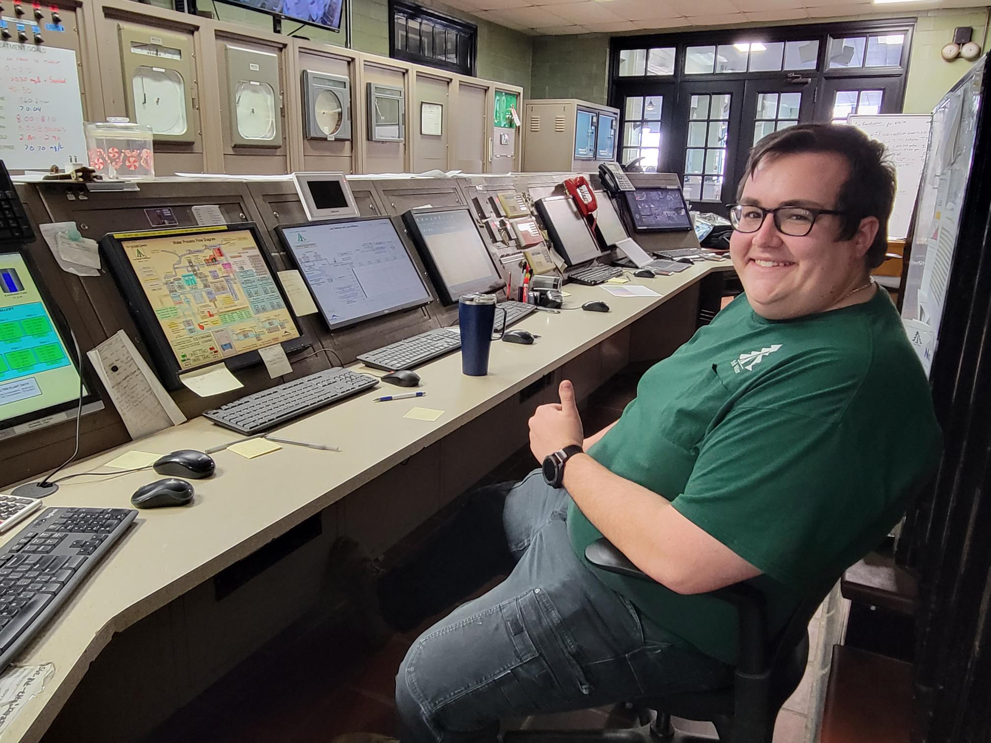 A York Water employee smiles and puts his thumb up while seated at the information console at the Water Filter Plant.