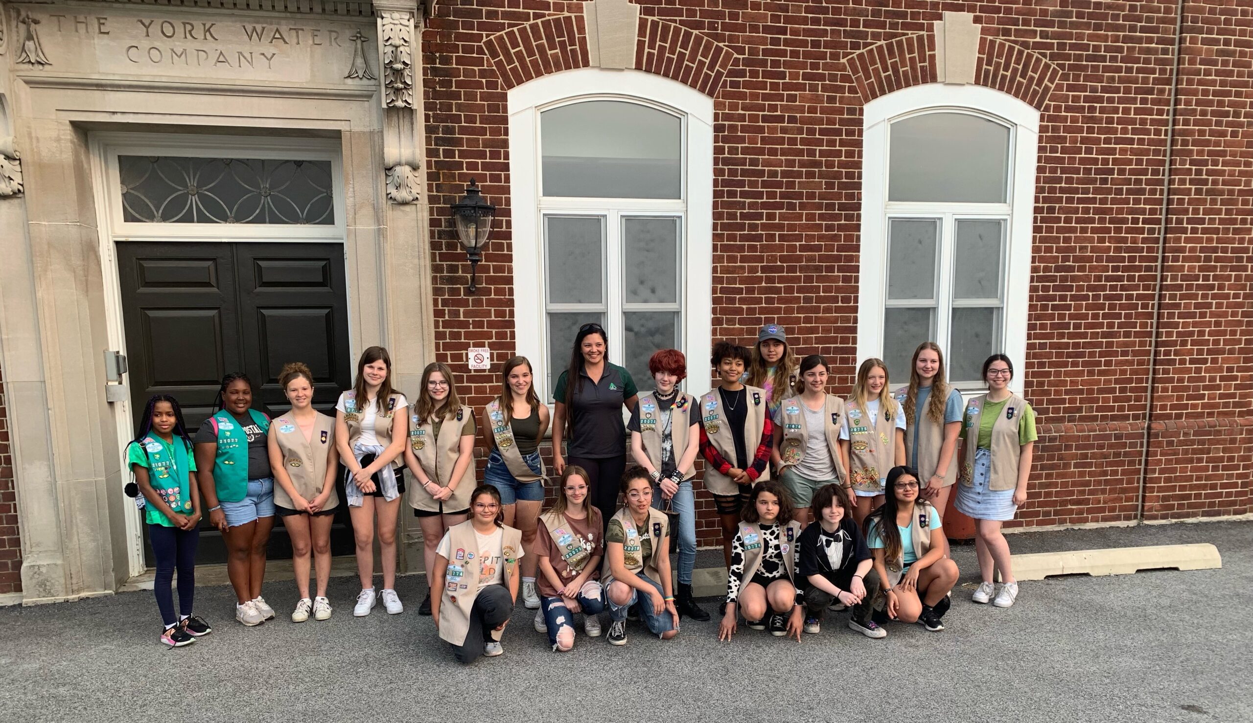 A York Water employee and a group of young Girl Scouts post in front of the Water Filter Plant.