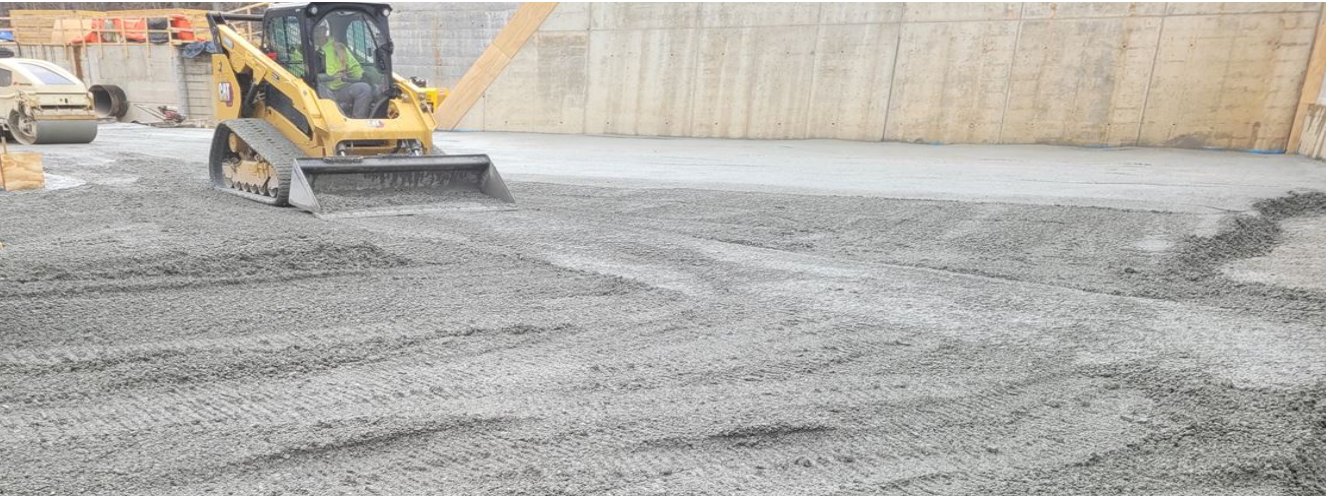 Compacting concrete at the Lake Williams Dam