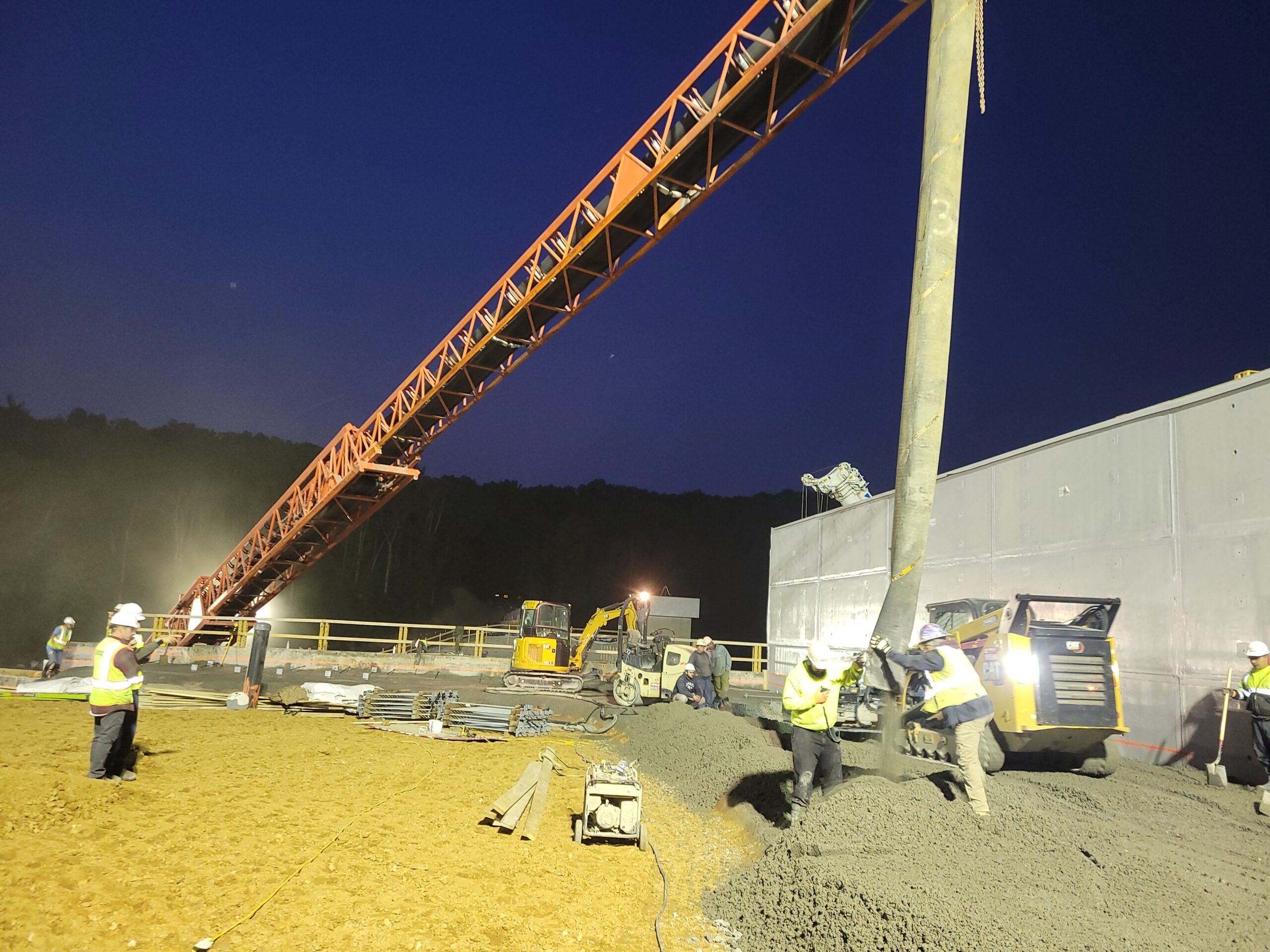 Pouring concrete at night for the Lake Williams Dam.