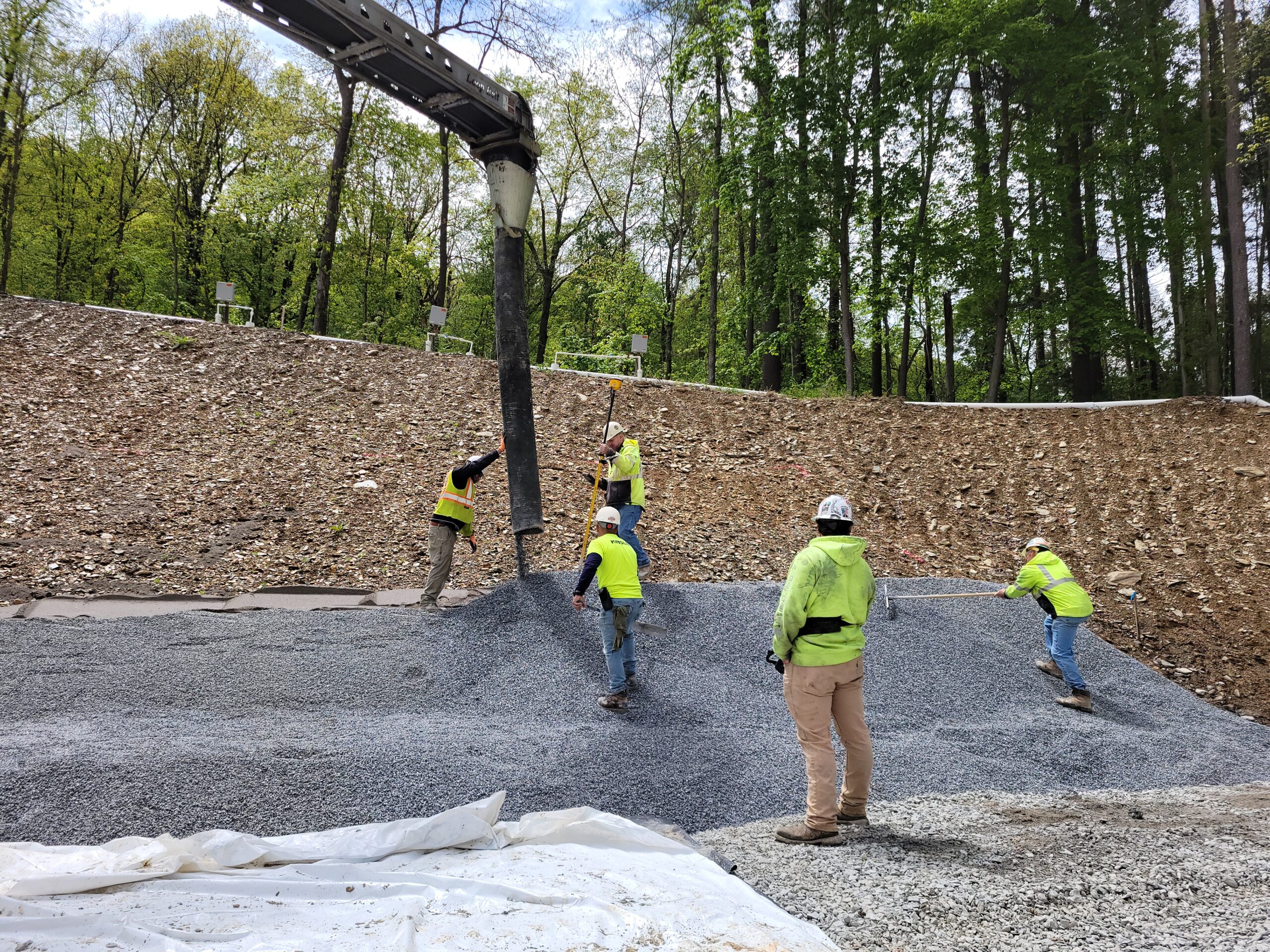 Construction workers pouring cement at the Lake Williams Dam.