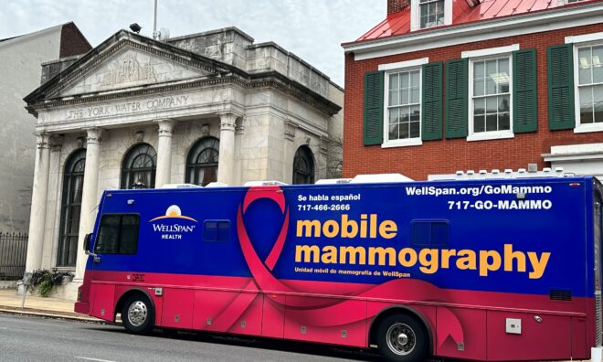 The WellSpan Mobile Mammography bus is parked in front of the York Water Company building.