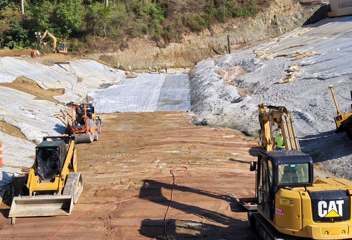 Heavy machinery working on the dam.