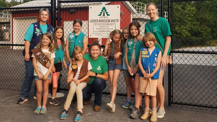 A Girl Scout troop poses for a group photo after a field trip at a York Water Company wastewater treatment plant.