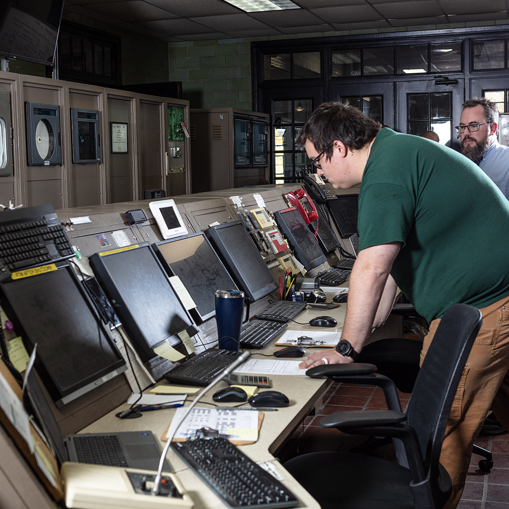 Two York Water employees view monitors in the water treatment plant control room.